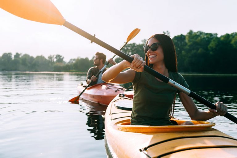 Couple kayaking on a lake