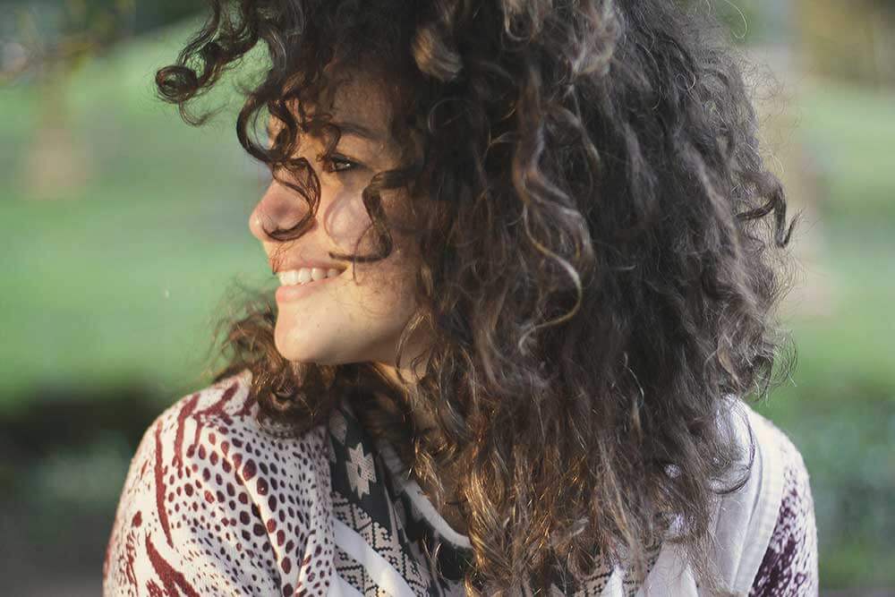 Young women looking to the side and smiling