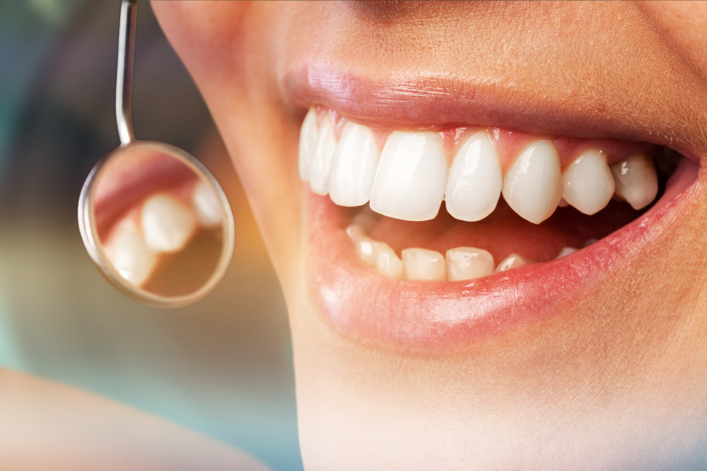 dentist examining a patient's gums